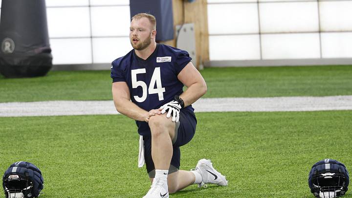 Logan Jones goes through stretching at Bears rookie camp. The former Iowa center is now working with the second team. Logan Jones goes through stretching at Bears rookie camp. The former Iowa center is now working with the second team.