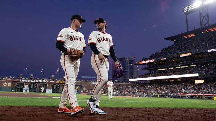 Jul 28, 2025; San Francisco, California, USA; San Francisco Giants third baseman Matt Chapman (26) and shortstop Willy Adames (2) walk off the field during the sixth inning against the Pittsburgh Pirates at Oracle Park. Mandatory Credit: D. Ross Cameron-Imagn Images