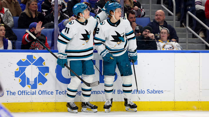 Mar 4, 2025; Buffalo, New York, USA;  San Jose Sharks center Will Smith (2) celebrates his goal with center Macklin Celebrini (71) during the third period against the Buffalo Sabres at KeyBank Center. Mandatory Credit: Timothy T. Ludwig-Imagn Images