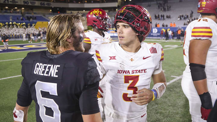 Oct 12, 2024; Morgantown, West Virginia, USA; Iowa State Cyclones quarterback Rocco Becht (3) speaks with West Virginia Mountaineers quarterback Garrett Greene (6) after a game at Mountaineer Field at Milan Puskar Stadium. Mandatory Credit: Ben Queen-Imagn Images