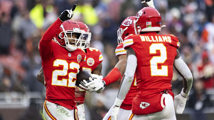Dec 15, 2024; Cleveland, Ohio, USA; Kansas City Chiefs cornerback Trent McDuffie (22) celebrates his interception with teammates against the Cleveland Browns during the fourth quarter at Huntington Bank Field. Mandatory Credit: Scott Galvin-Imagn Images