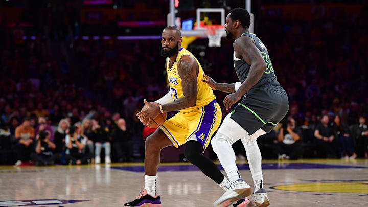 Apr 30, 2025; Los Angeles, California, USA; Los Angeles Lakers forward LeBron James (23) controls the ball against Minnesota Timberwolves forward Julius Randle (30) during the first half in game five of first round for the 2025 NBA Playoffs at Crypto.com Arena. Mandatory Credit: Gary A. Vasquez-Imagn Images Apr 30, 2025; Los Angeles, California, USA; Los Angeles Lakers forward LeBron James (23) controls the ball against Minnesota Timberwolves forward Julius Randle (30) during the first half in game five of first round for the 2025 NBA Playoffs at Crypto.com Arena. Mandatory Credit: Gary A. Vasquez-Imagn Images