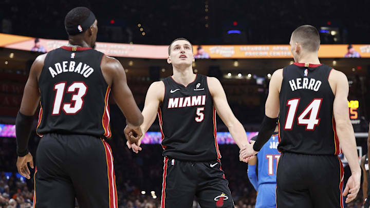 Feb 12, 2025; Oklahoma City, Oklahoma, USA; Miami Heat forward Nikola Jovic (5) celebrates with teammates center Bam Adebayo (13) and guard Tyler Herro (14) after a play against the Oklahoma City Thunder during the second quarter at Paycom Center. Mandatory Credit: Alonzo Adams-Imagn Images
