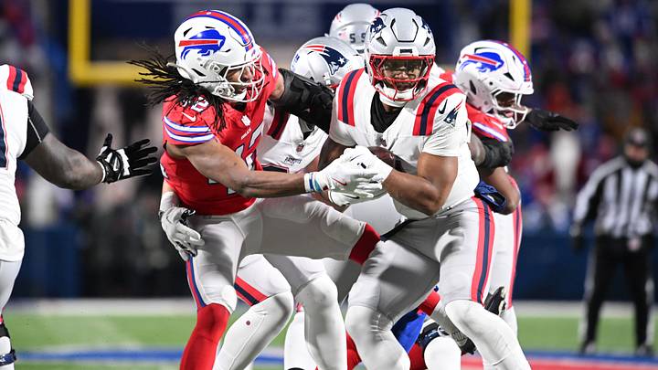 Dec. 22, 2024; Orchard Park, New York, USA; Buffalo Bills' linebacker Dorian Williams (42) tries to strip the ball from former New England Patriots' running back Antonio Gibson (4) during an NFL game at the old Highmark Stadium. Dec. 22, 2024; Orchard Park, New York, USA; Buffalo Bills' linebacker Dorian Williams (42) tries to strip the ball from former New England Patriots' running back Antonio Gibson (4) during an NFL game at the old Highmark Stadium.