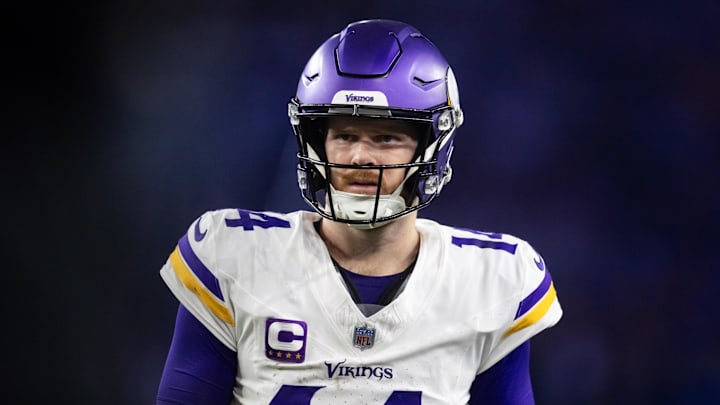 Jan 13, 2025; Glendale, AZ, USA; Minnesota Vikings quarterback Sam Darnold (14) against the Los Angeles Rams during an NFC wild card game at State Farm Stadium. Mandatory Credit: Mark J. Rebilas-Imagn Images