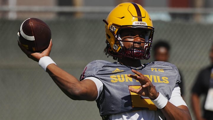 ASU quarterback Jaden Rashada (5) throws a pass during a spring practice at the Kajikawa practice