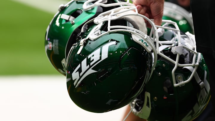 Oct 6, 2024; Tottenham, ENG; New York Jets helmets are held by staff before the match against Minnesota Vikings at Tottenham Hotspur Stadium. Mandatory Credit: Shaun Brooks-Imagn Images