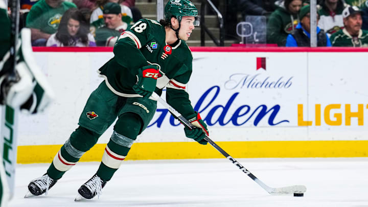 Jan 15, 2024; Saint Paul, Minnesota, USA; Minnesota Wild defenseman Daemon Hunt (48) looks to pass during the first period against the New York Islanders at Xcel Energy Center. Mandatory Credit: Brace Hemmelgarn-Imagn Images