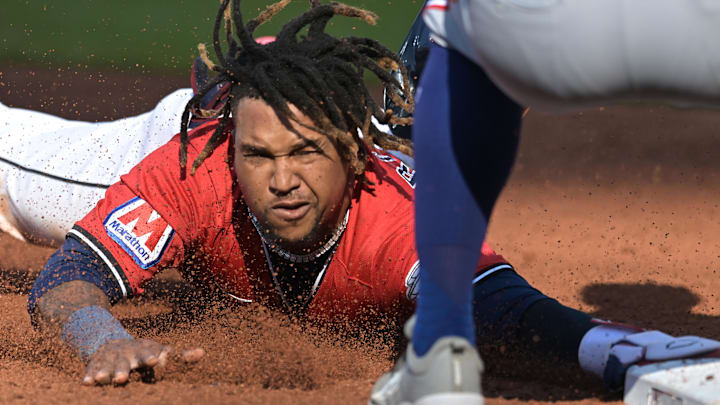 Sep 28, 2025; Cleveland, Ohio, USA;  Cleveland Guardians third baseman Jose Ramirez (11) steals third base against the Texas Rangers during the third inning at Progressive Field. Mandatory Credit: Ken Blaze-Imagn Images