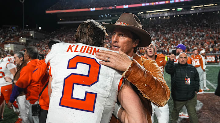Dec 21, 2024; Austin, Texas, USA; Movie actor Matthew McConaughey (right) meets Clemson Tigers quarterback Cade Klubnik (2) after a victory by the Texas Longhorns in the first round of the College Football Playoffs at Darrell K Royal-Texas Memorial Stadium. Mandatory Credit: Aaron E. Martinez/USA Today Network via Imagn Images