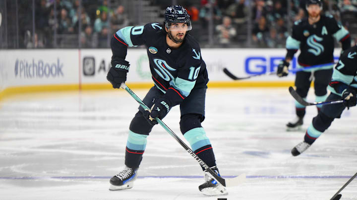 Mar 14, 2024; Seattle, Washington, USA; Seattle Kraken center Matty Beniers (10) looks to pass the puck during the second period against the Washington Capitals at Climate Pledge Arena. Mandatory Credit: Steven Bisig-Imagn Images