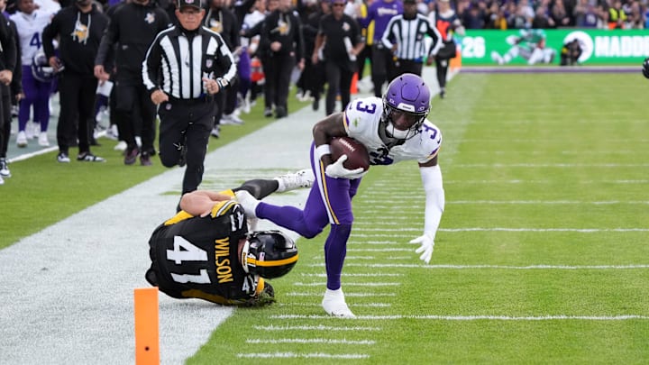 Sep 28, 2025; Dublin, Ireland; Minnesota Vikings wide receiver Jordan Addison (3) carries the ball on an 81-yard reception against Pittsburgh Steelers linebacker Payton Wilson (41) in the fourth quarter during an NFL International Series game at Croke Park. Mandatory Credit: Kirby Lee-Imagn Images Sep 28, 2025; Dublin, Ireland; Minnesota Vikings wide receiver Jordan Addison (3) carries the ball on an 81-yard reception against Pittsburgh Steelers linebacker Payton Wilson (41) in the fourth quarter during an NFL International Series game at Croke Park. Mandatory Credit: Kirby Lee-Imagn Images