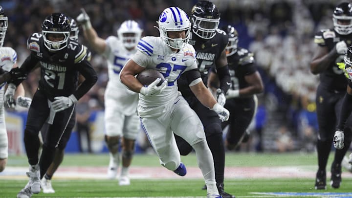 Dec 28, 2024; San Antonio, TX, USA; Brigham Young Cougars running back LJ Martin (27) runs with the ball during the fourth quarter against the Colorado Buffaloes at Alamodome. Mandatory Credit: Troy Taormina-Imagn Images