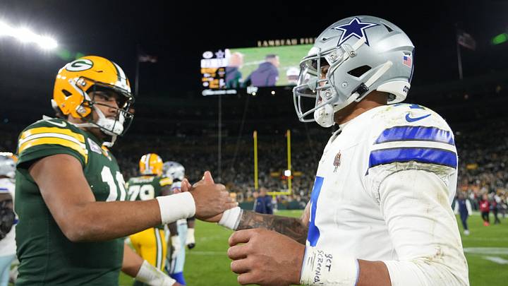 Dallas Cowboys quarterback Dak Prescott and Green Bay Packers quarterback Jordan Love shake hands after the game at Lambeau Field.  