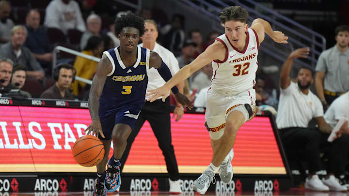 Nov 4, 2024; Los Angeles, California, USA; Chattanooga Mocs guard Honor Huff (3) dribbles the ball against Southern California Trojans guard Clark Slajchert (32) in the second half at Galen Center. Mandatory Credit: Kirby Lee-Imagn Images