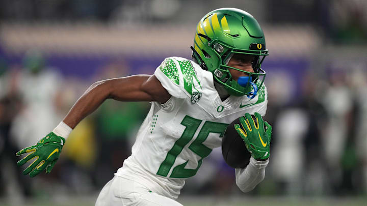 Dec 1, 2023; Las Vegas, NV, USA; Oregon Ducks wide receiver Tez Johnson (15) carries the ball against the Washington Huskies in the first half at Allegiant Stadium. Mandatory Credit: Kirby Lee-USA TODAY Sports