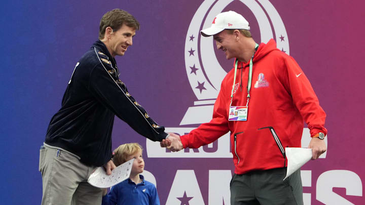 Feb 5, 2023; Paradise, Nevada, USA; NFC captain Eli Manning (left) and AFC captain Peyton Manning shake hands during the Pro Bowl Games at Allegiant Stadium.  
