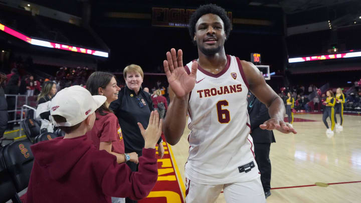 Jan 3, 2024; Los Angeles, California, USA; Southern California Trojans guard Bronny James (6) is greeted by fans after the game against the California Golden Bears at Galen Center. Mandatory Credit: Kirby Lee-USA TODAY Sports