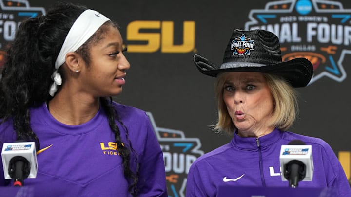Mar 30, 2023; Dallas, TX, USA; LSU Tigers forward Angel Reese (left) and coach Kim Mulkey react during the press conference at the American Airlines Center. Mandatory Credit: Kirby Lee-Imagn Images