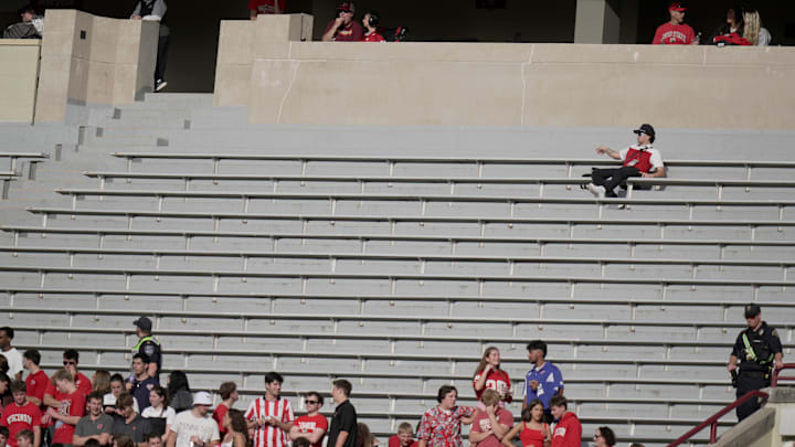 Oct 18, 2025; Madison, Wisconsin, USA; A man has a large seating area to himself during the second quarter of the Wisconsin Badgers - Ohio State football game at Camp Randall Stadium. Oct 18, 2025; Madison, Wisconsin, USA; A man has a large seating area to himself during the second quarter of the Wisconsin Badgers - Ohio State football game at Camp Randall Stadium.
