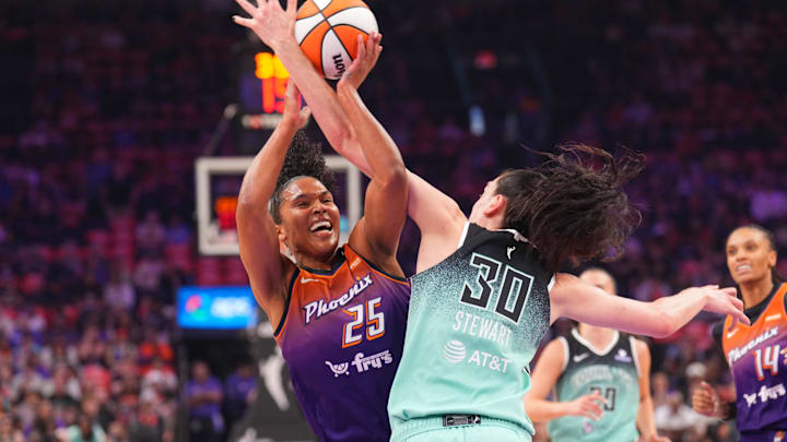 Sep 19, 2025; Phoenix, Arizona, USA; Phoenix Mercury forward Alyssa Thomas (25) is fouled by New York Liberty forward Breanna Stewart (30) during the first half of game three of round one for the 2025 WNBA Playoffs at PHX Arena. Mandatory Credit: Joe Camporeale-Imagn Images