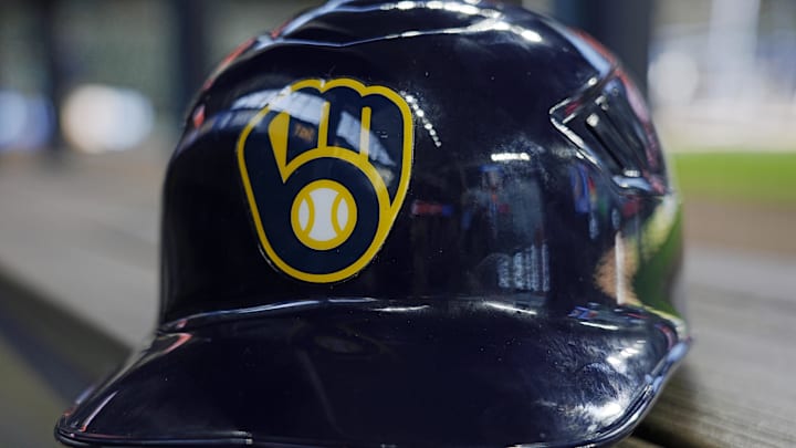 Jun 10, 2024; Milwaukee, Wisconsin, USA;  A Milwaukee Brewers batting helmet sits on the bench during batting practice prior to the game against the Toronto Blue Jays at American Family Field. Mandatory Credit: Jeff Hanisch-Imagn Images