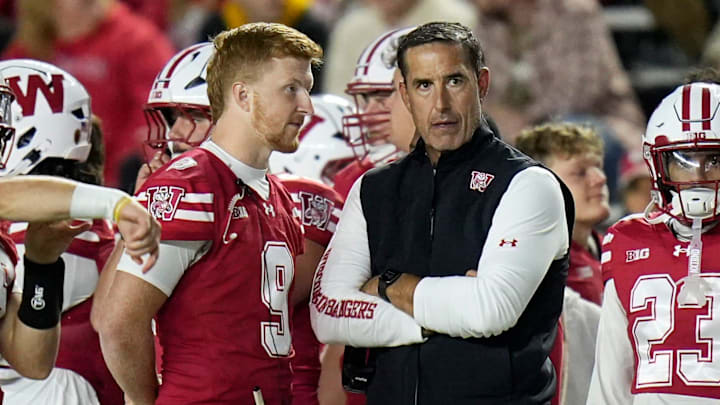 Wisconsin Badgers head coach Luke Fickell stands next to injured quarterback Billy Edwards Jr. during the second half of the game against the Iowa Hawkeyes, October 11, 2025, at Camp Randall in Madison