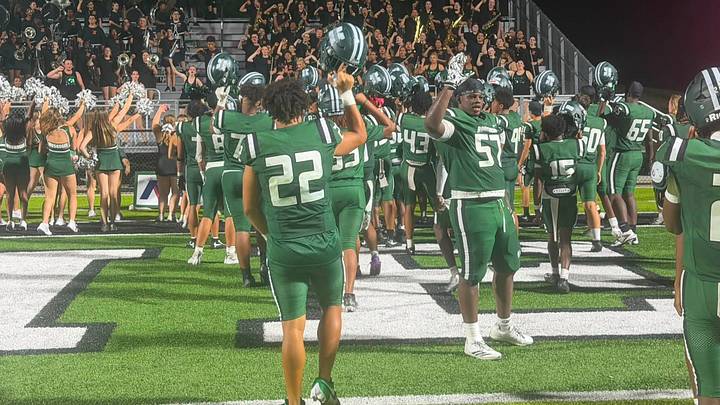 Muskogee players celebrate with their band after a recent victory. Muskogee players celebrate with their band after a recent victory.