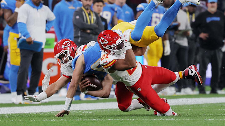 [US, Mexico & Canada customers only] Sep 5, 2025; Sao Paulo, BRAZIL; Kansas City Chiefs safety Jaden Hicks (21) and linebacker Drue Tranquill (23) in action with Los Angeles Chargers quarterback Justin Herbert (10) in the first half during a NFL game at Corinthians Arena. Mandatory Credit: Amanda Perobelli/Reuters via Imagn Images