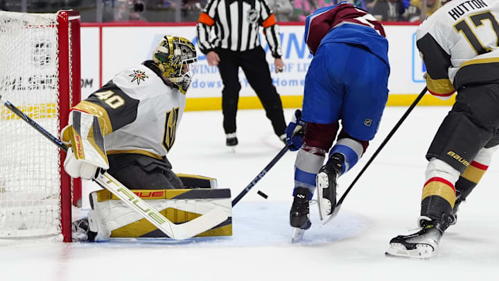 Apr 8, 2025; Denver, Colorado, USA; Colorado Avalanche right wing Logan O'Connor (25) shoots the puck at Vegas Golden Knights goaltender Akira Schmid (40) in the second period at Ball Arena. Mandatory Credit: Ron Chenoy-Imagn Images