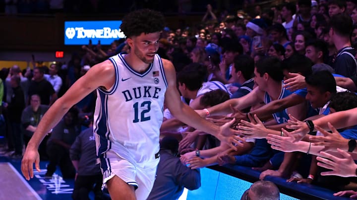 Jan 10, 2026; Durham, North Carolina, USA; Duke Blue Devils forward Cameron Boozer (12) greets fans after a game against the Southern Methodist Mustangs at Cameron Indoor Stadium. Mandatory Credit: Rob Kinnan-Imagn Images