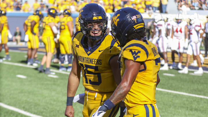 Aug 30, 2025; Morgantown, West Virginia, USA; West Virginia Mountaineers quarterback Scotty Fox Jr. (15) celebrates after scoring a touchdown during the fourth quarter against the Robert Morris Colonials at Milan Puskar Stadium. Mandatory Credit: Ben Queen-Imagn Images Aug 30, 2025; Morgantown, West Virginia, USA; West Virginia Mountaineers quarterback Scotty Fox Jr. (15) celebrates after scoring a touchdown during the fourth quarter against the Robert Morris Colonials at Milan Puskar Stadium. Mandatory Credit: Ben Queen-Imagn Images