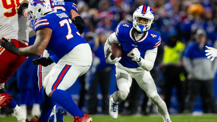 Jan 21, 2024; Orchard Park, New York, USA; Buffalo Bills running back James Cook (4) against the Kansas City Chiefs in the 2024 AFC divisional round game at Highmark Stadium. Mandatory Credit: Mark J. Rebilas-USA TODAY Sports