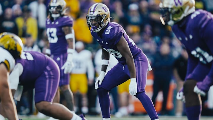 Khmori House started five games as a freshman linebacker for the Huskies. 