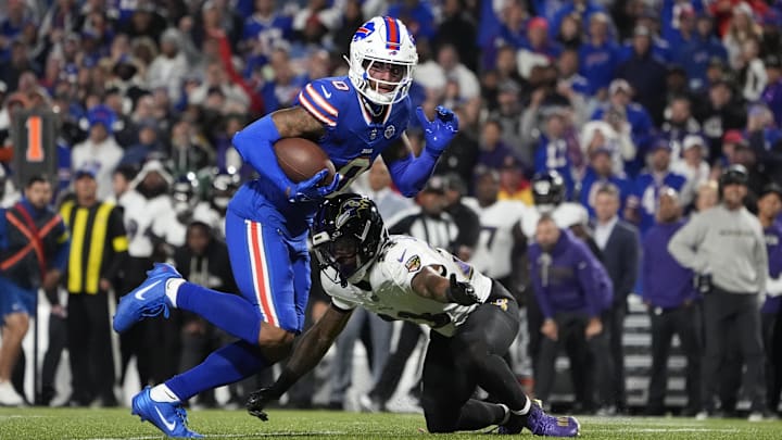 Sep 7, 2025; Orchard Park, New York, USA;  Buffalo Bills wide receiver Keon Coleman (0) runs the ball against Baltimore Ravens cornerback Jaire Alexander (23) during the fourth quarter at Highmark Stadium. Mandatory Credit: Gregory Fisher-Imagn Images