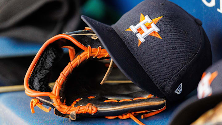 Apr 27, 2025; Kansas City, Missouri, USA; Houston Astros hat and glove in the dugout during the second inning against the Kansas City Royals at Kauffman Stadium. Apr 27, 2025; Kansas City, Missouri, USA; Houston Astros hat and glove in the dugout during the second inning against the Kansas City Royals at Kauffman Stadium.