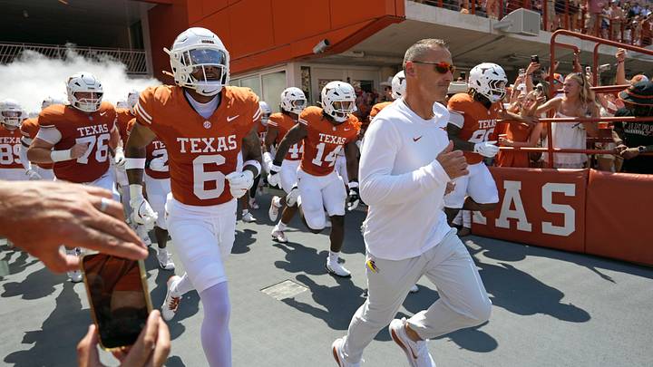 Texas Longhorns Head Coach Steve Sarkisian leads his team on to the field before a game against the Texas State Bobcats