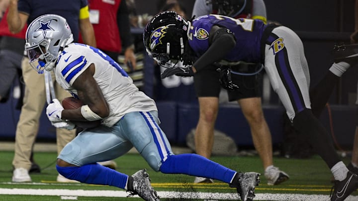 Dallas Cowboys wide receiver Jonathan Mingo catches a pass in front of Baltimore Ravens cornerback T.J. Tampa.