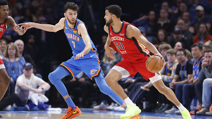 Feb 10, 2025; Oklahoma City, Oklahoma, USA; New Orleans Pelicans forward Jeremiah Robinson-Earl (50) drives to the basket beside Oklahoma City Thunder forward Chet Holmgren (7) during the second quarter at Paycom Center. Mandatory Credit: Alonzo Adams-Imagn Images