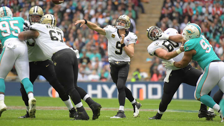 Oct 1, 2017; London, United Kingdom; New Orleans Saints quarterback Drew Brees (9) throws a pass against the Miami Dolphins during the NFL International Series game at Wembley Stadium. The Saints defeated the Dolphins 20-0. Mandatory Credit: Kirby Lee-Imagn Images Oct 1, 2017; London, United Kingdom; New Orleans Saints quarterback Drew Brees (9) throws a pass against the Miami Dolphins during the NFL International Series game at Wembley Stadium. The Saints defeated the Dolphins 20-0. Mandatory Credit: Kirby Lee-Imagn Images