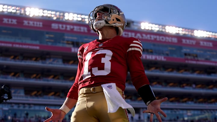 Dec 8, 2024; Santa Clara, California, USA; San Francisco 49ers quarterback Brock Purdy (13) reacts after rushing for a touchdown against the Chicago Bears in the second quarter at Levi's Stadium. The play was later called back for offensive holding. Mandatory Credit: Cary Edmondson-Imagn Images