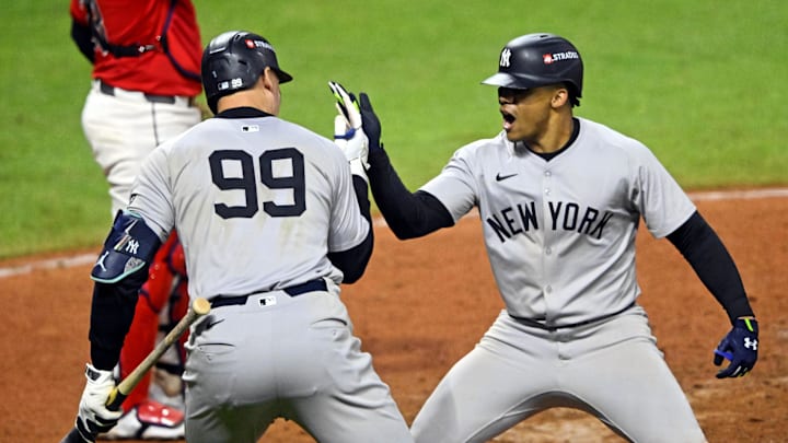 Oct 19, 2024; Cleveland, Ohio, USA; New York Yankees outfielder Juan Soto (22) celebrates with outfielder Aaron Judge (99) after hitting a three run home run during the tenth inning against the Cleveland Guardians during game five of the ALCS for the 2024 MLB playoffs at Progressive Field. Mandatory Credit: David Richard-Imagn Images