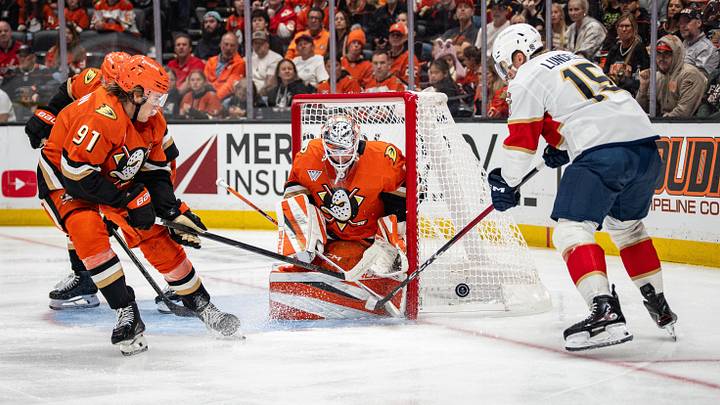 Florida Panthers' Anton Lundell (15) takes a shot against the Anaheim Ducks goaltender Lukas Dostal (1) defending during the first period at Honda Center.  Mandatory Credit: Corinne Votaw-Imagn Images