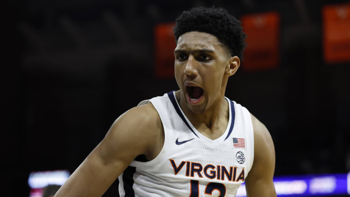 Jan 24, 2024; Charlottesville, Virginia, USA; Virginia Cavaliers guard Ryan Dunn (13) reacts after a dunk against the North Carolina State Wolfpack in overtime at John Paul Jones Arena. Mandatory Credit: Geoff Burke-USA TODAY Sports