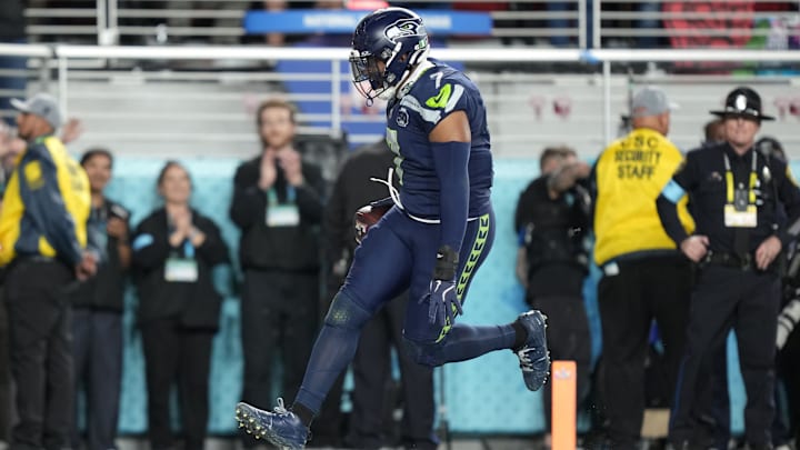 Seattle Seahawks linebacker Uchenna Nwosu (7) runs to score a touchdown against the New England Patriots.