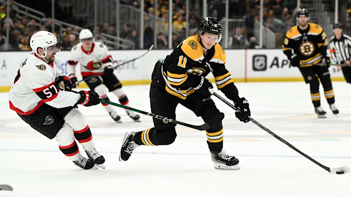 Jan 23, 2025; Boston, Massachusetts, USA; Boston Bruins center Trent Frederic (11) skates against the Ottawa Senators during the third period at the TD Garden. Mandatory Credit: Brian Fluharty-Imagn Images