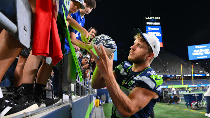 Aug 7, 2025; Seattle, Washington, USA; Seattle Seahawks wide receiver Cooper Kupp (10) interacts with fans after the game against the Las Vegas Raiders at Lumen Field. Mandatory Credit: Steven Bisig-Imagn Images