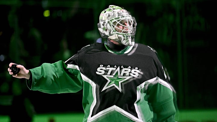 Apr 20, 2026; Dallas, Texas, USA; Dallas Stars goaltender Jake Oettinger (29) throws a puck to the fans after the win over the Minnesota Wild in game two of the first round of the 2026 Stanley Cup Playoffs at American Airlines Center. Mandatory Credit: Jerome Miron-Imagn Images