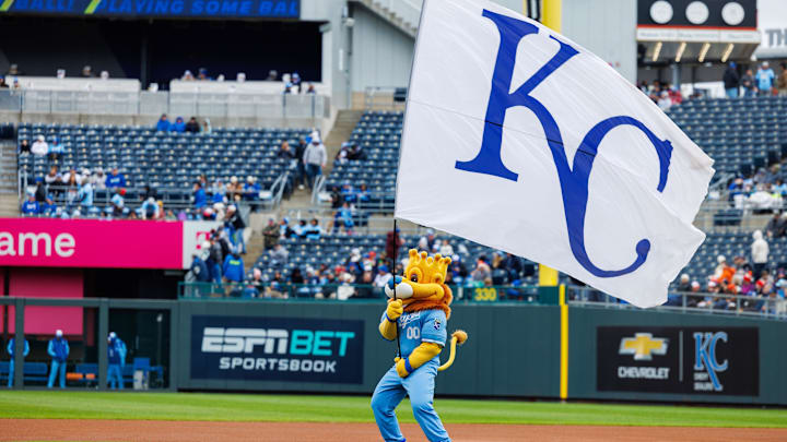 Apr 5, 2025; Kansas City, Missouri, USA; Kansas City Royals mascot Sluggerrr waves the flag prior to the game against the Baltimore Orioles at Kauffman Stadium. Mandatory Credit: William Purnell-Imagn Images Apr 5, 2025; Kansas City, Missouri, USA; Kansas City Royals mascot Sluggerrr waves the flag prior to the game against the Baltimore Orioles at Kauffman Stadium. Mandatory Credit: William Purnell-Imagn Images