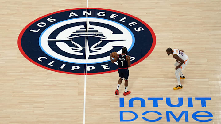 LA Clippers guard James Harden (1) dribbles the ball against Phoenix Suns forward Kevin Durant (35) at Intuit Dome. 